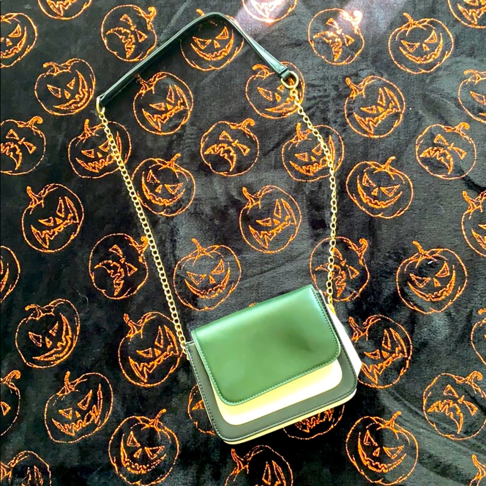 Green, white and black purse